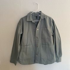 Size Small But It Fits Oversized, It Could Definitely Fit Up To A Large. Never Worn Casual Khaki Shacket With Buttoned Pockets, Green Oversized Outerwear With Buttoned Pockets, Green Relaxed Fit Button-up Shacket, Oversized Utility Jacket With Buttoned Pockets For Everyday, Trendy Collared Denim Jacket For Everyday, Urban Spring Button-up Shacket, Spring Urban Button-up Shacket, Trendy Green Oversized Shacket, Casual Button-up Shacket