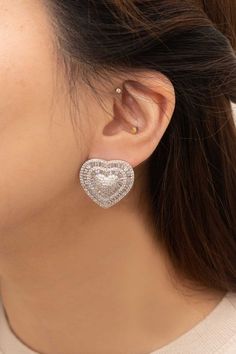 Crafted for a classic look, these Sterling Silver Amiya Heart Statement Earrings feature heart-shaped designs with round and baguette stones. Each earring is made of sterling silver and designed with a stud finish, adding a subtle yet elegant sparkle to any look. At a lightweight 3 grams, these earrings are perfect for everyday wear. Material: Sterling silver Closure Type: Stud finish Heart shape design Weight: 3 Grams Measurement: 1in x 1in / 2.54cm x 2.54cm Nonrefundable Coconut Wax Candles, Silver Statement Earrings, Large Heart, Womens Watches Luxury, Baguette Cut Diamond, Stunning Earrings, Keep Jewelry, Sterling Silver Heart, Ear Jewelry