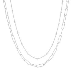 Sometimes, opposites really do attract! Case in point, this double-strand necklace makes one chic piece. It features a silver paperclip chain and a beaded station chain. Its high contrast works best with simpler tops and dresses. The piece comes with a “.925” sterling silver quality stamp as a symbol of guaranteed product quality. Made in Italy. Silver Double Chain Layered Necklace In Sterling Silver, Modern Sterling Silver Double Chain Jewelry, Sterling Silver Double Chain Necklace For Layering, Silver Minimalist Layered Necklace With Double Chain, Silver Cable Chain Necklace For Layering, Modern Silver Double Chain Necklace, Sterling Silver Double Strand Chain Necklace, Sterling Silver Double Chain Necklace, Modern Sterling Silver Necklaces With Double Chain