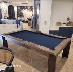 a pool table in the middle of a living room