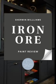 the iron ore paint review is in front of a black cabinet with an open door