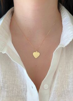 "Dainty And Elegant 14K Yellow Gold Heart Pendant Charm. This Minimalist Pendant Will Be A Great Addition To Any Other Jewelry Your Wear On Your Neck. Charm Is Sturdy And Solid And Comes With The Option Of A High Quality Box Chain That Feels Very Silky. A Beautiful Gift She Will Treasure Forever! Jewelry Comes In A Cute Gift Box Ready To Present. Model Is Wearing A 16\" Chain. -Chain Is Additional, Look At The Length Options - All Jewelry Is New And Inspected For Quality Assurance. -Jewelry Is C 14k Gold Everyday Heart Necklace, Everyday 14k Gold Heart Necklace, Everyday Yellow Gold Heart Necklace With Heart Detail, Everyday Yellow Gold Heart Necklace, Yellow Gold Heart Necklace Stamped 14k, Heart Disc, Gold Heart Pendant, Minimalist Pendant, Cute Gift Boxes