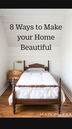 a bed sitting in the corner of a room next to a wooden dresser and lamp