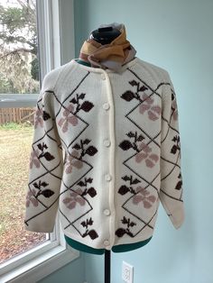 "Thick Acrylic 60's -70's Sweater  Crew neck Button front with Raglan sleeves  Leafy design on front in colors of beige and dark chocolate brown  Yarn covered buttons  Boxy fit  Size 12-14 Shoulders- 16 1/2\" Sleeves -23\" 24\" Bust -44\" Waist -46\" Length - 22 1/2\" Beautiful vintage condition,pre owned" White Retro Sweater With Buttons, Retro White Sweater With Buttons, Retro Fitted Sweater With Button Closure, Vintage Cream Sweater With Button Closure, Vintage Fitted Sweater With Buttons, Fitted Vintage Sweater With Buttons, 60s Sweater, Vintage Linen Dress, Hippie Sweaters