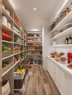 a kitchen filled with lots of white shelves and food on top of wooden flooring