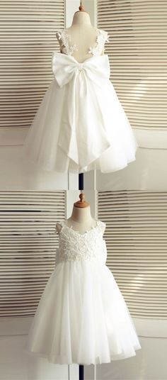 two white dresses hanging on a mannequin