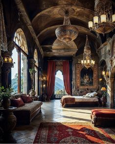 an ornate bedroom with red curtains and chandelier hanging from the ceiling, surrounded by large windows