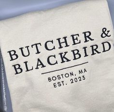 Cookies and cream ice cream not included, sorry! A soft, embroidered, cotton crew neck inspired by the fictional downtown Boston restaurant that the Butcher opened for his Blackbird. We'll save you a booth!  Pre-shrunk crew neck Unisex sizing Wash in cold with like colors Gentle tumble dry Do not bleach Iron inside out Butcher And Blackbird Aesthetic, Butcher And Blackbird, Bingo Books, Cookies And Cream Ice Cream, Acrylic Bookmarks, Romcom Books, Boston Restaurants, Downtown Boston, Cream Ice Cream