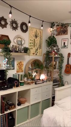 a room filled with lots of plants and decorations