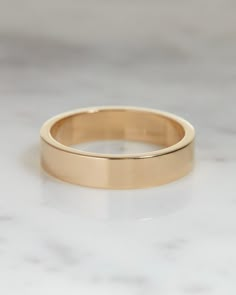 The Classique Cigar Band epitomizes everyday elegance with its prominent metal look, offering the perfect blend of style and comfort. Its ideal amount of shine makes it a must-have accessory for any occasion. Flat Gold Ring, Simple Band Rings Women, Simple Thick Gold Wedding Band, Wedding Thick Band Ring In 14k Gold, Women’s Thick Gold Wedding Band, Timeless 14k Gold Thick Band, Modern 14k Gold Thick Band For Wedding, Wedding Band His, Wedding Band For Men