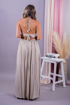 Vacay approved is our From The Source Pocketed Halter Maxi Dress is perfect for any event this season. We love the flowy, lightweight striped fabrication for a classy and flattering fit. Designed with maxi length on a plunging halter neckline, side pockets, partial elastic waistband and an adjustable back tie design. We are swooning over this adorable maxi and you will too! Pair with your favorite heels for a chic look or with sandals to keep it casual! Color: Black/Cream Maxi Length Bump Friend Striped Maxi Dress For Summer Evenings, Elegant Striped Maxi Dress For Spring, Elegant Striped Maxi Dress For Party, Striped Maxi Dress For Summer Party, Flowy Tie-back Maxi Dress For Date Night, Chic Striped Maxi Dress, Spring Party Striped Maxi Dress, Flowy Halter Neck Breezy Maxi Dress, Chic Striped Evening Maxi Dress