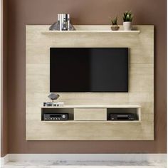 an entertainment center with a flat screen tv mounted on the wall