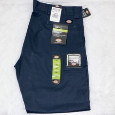 Elevate Your Workwear Style With These Navy Blue Dickies Twill Work Pants. Designed With A Slim Fit And Tapered Leg, These Pants Provide A Modern And Flattering Look. The Zip And Hook & Eye Closure Ensures A Secure Fit, While The Slimming Feature Adds An Extra Touch Of Confidence. Crafted From Durable Materials And Available In Size 38x32, These Pants Are Perfect For Any Season. The Blue Color Adds A Pop Of Style To Your Wardrobe, While The Dickies Brand Guarantees Quality. Add These Work Pants To Your Collection And Step Up Your Fashion Game. Brand New With Tags Size: 38x32 Smoke & Odor Free Fast Shipping Message Us With Any Questions Id:A1 02323 Blue Jeans With Hip Pockets For Work, Navy Cotton Tapered Leg Work Pants, Relaxed Fit Blue Cargo Pants With Belt Loops, Casual Blue Work Pants With Hip Pockets, Blue Tapered Leg Cargo Pants For Work, Blue Workwear Bottoms Standard Cut, Navy Cotton Straight Leg Work Pants, Navy Work Pants With Pockets, Blue Cotton Cargo Pants For Work