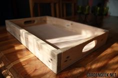 a wooden tray sitting on top of a table