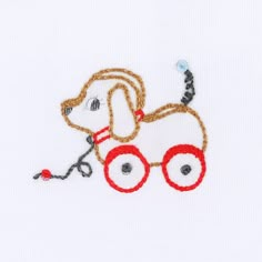 a dog with glasses on it's face is embroidered onto a white t - shirt