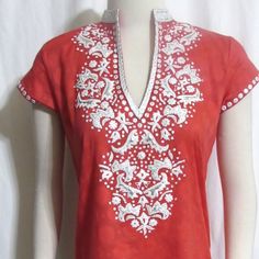 This Is A Gorgeous Coral Red With White Embroidery Shift Sheath Just Above The Knee Length Mini Dress By Sulu Collection. It Is Brand New, In Perfect Condition And A Size S Small. Please Check Measurements Below For Fit. The Fabric Is 100% Cotton Exclusive Of Decoration. It Is Dry Clean Only. The Main Color Is A Gorgeous Coral Red With Bright White Intricate Embroidery. Some Of The Larger Designs Have Metallic Silver Insets And Some Smaller Designs Have A Tiny Square Mirror Accent. The Neckline Red Tops With Resham Embroidery For Summer, White Short Sleeve Festive Dress, Elegant Red Dress With Chikankari Embroidery, Red Embroidered Neckline Festive Dress, Festive Red Dress With Embroidered Neckline, Red Short Sleeve Top With Resham Embroidery, Red Chikankari Embroidery Summer Dress, Fitted Red Tunic Dress, Red Fitted Tunic Dress