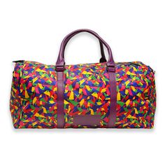 When you're the life of the party, even your duffel bag gets in on the action. The perfect size for a weekend away, this colorful duffel is printed with our own rainbow confetti design. Trimmed in purple faux leather, with purple handles, removable purple shoulder strap, a black zipper, and purple canvas interior lining with extra zipper pocket, this duffel has room for a three-day weekend's worth of outfits, including shoes! 22" long by 10" wide by 13.5" tall (56 cm x 25 cm x 34 cm) Purple vega Purple Duffle Bag For Daily Use, Rectangular Purple Travel Bag For On-the-go, Purple Rectangular Duffle Bag For Daily Use, Rectangular Purple Duffle Bag For Everyday Use, Rectangular Purple Duffle Bag, Rectangular Purple School Travel Bag, Purple Travel Bag With Luggage Sleeve For Everyday Use, Purple Rectangular Duffle Bag For Travel, Rectangular Purple Duffle Bag For Travel