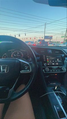 the interior of a car with dashboard lights and steering wheel