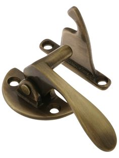 an antique brass door handle with two handles on the front and back ends, one is open