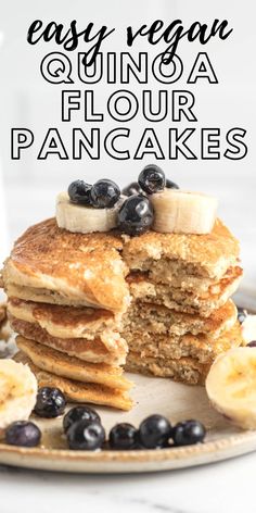 a stack of pancakes with blueberries and bananas on top