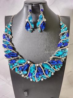 Ocean Blue Statement Crystal Necklace Set that will make your outfit pop. Elegant and Vibrant stone colors give this necklace its beauty. Definitely worth it!! *SHIPPING It will take about 2-5 business days to process your GEMS. I DONT SHIP on WEEKENDS or HOLIDAYS. Once your item has shipped you will receive an email through Etsy. Delays due to weather or package arriving later than expected can happen so please be patient and understanding. Make sure to call your local post office to find out the wear abouts of your package.  *RETURNS ** ALL JEWELRY ARE FINAL SALE!! RETURNS AND EXCHANGES ARE NOT ACCEPTED If there is an issue with your GEMS due to the handling of shipping please contact me. Thank you for shopping at BBGEMS21! Ladies you are GEMS let it SHINE! Wedding Jewelry Necklace, Wedding Brooch, Wedding Jewellery, Wedding Jewellery Necklace, Jewelry Wedding, Art Deco Jewelry, Wedding Jewelry Sets, Ocean Blue, Jewelry Necklace