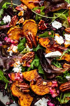 a salad with lettuce, carrots and feta cheese