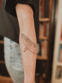 a person with a tattoo on their arm