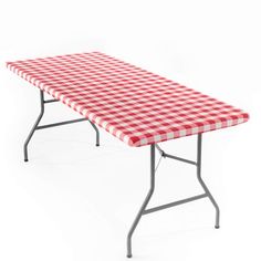 a red and white checkered tablecloth is on the top of this folding table