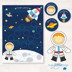 an astronaut themed bulletin board with stickers and magnets for kids to use on the outer space theme