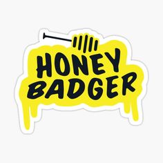 the honey badger sticker is yellow with black lettering and an image of a bee on it