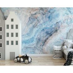 a child's bedroom with marble wallpaper and toy car in the foreground