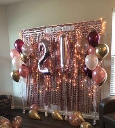 balloons and streamers are arranged in the shape of numbers