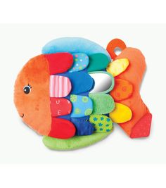 a stuffed fish toy with lots of colorful toys on it's back legs and eyes