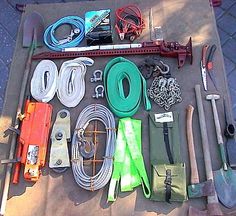 various tools are laid out on the ground together, including wrenches, pliers and hoses