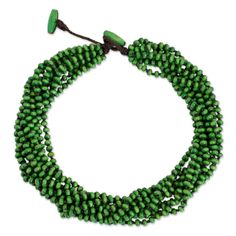 three strand green glass beaded necklace with clasps on an adjustable cord, approximately from the waist up