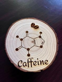 the word caffeine written on a piece of wood