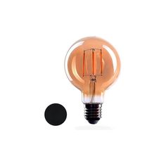 an orange light bulb sitting on top of a white table next to a black dot