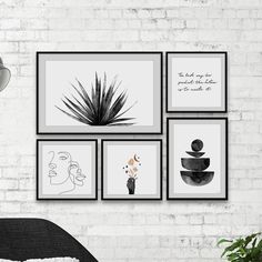 four black and white pictures hanging on a brick wall next to a chair with a plant in it