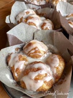 glazed donuts with icing in a basket