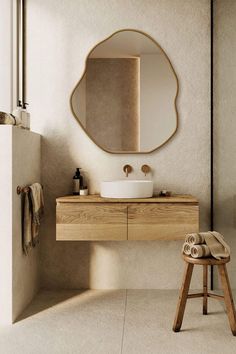 a bathroom with a sink, mirror and stool