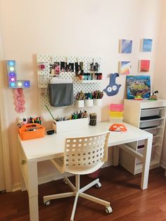 a white desk and chair in a room