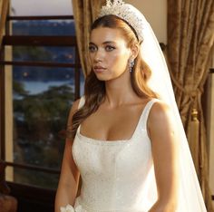 a woman in a wedding dress with a tiara