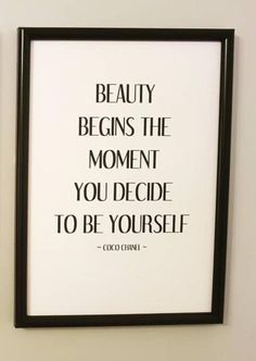 a black and white print with the quote beauty begins the moment you decide to be yourself