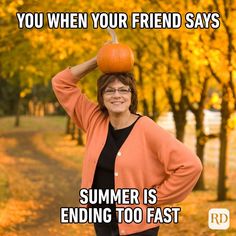 a woman in an orange cardigan holding a pumpkin on her head with the caption, you when your friend says summer is ending too fast