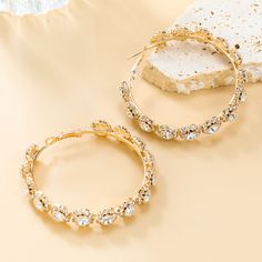 An Evening Of Elegance Would Not Be Complete Without These Glamorous, Rhinestone Hoops!
IRON, BRASS, GLASS

Color: Gold
Hoop Earring Detail
Rhinestone Detail
Clear Gem Detail
Textured Detail
2.5" Drop Length
2.5" Diameter Rhinestone Hoop Earrings, Gold Hoop Earring, Creepy Images, Chill Room, Jean Accessories, Brass Glass, Glass Color, Christmas Earrings, Gold Hoop