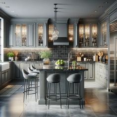 a kitchen with gray cabinets and marble counter tops, two bar stools at the center