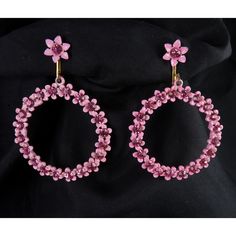 Such cheer is to be found in these 1960's clip on hoop earrings made of bright pink enameled metal flowers with pink rhinestone centers! Each earring is just under 2" high and 1 7/16" wide. The backs are gold-plated as are the clip tops. Condition is unworn and excellent! Flower Power reigns again! Please use the "View Shop Policies" link on the lower right of each item page for important information before you order. Pink Metal Clip-on Earrings For Gift, Pink Metal Clip-on Earrings As A Gift, Pink Enamel Jewelry For Party, Pink Enamel Party Jewelry, Pink Clip-on Flower Earrings For Gift, Pink Flower Metal Earrings, Pink Enamel Flower-shaped Jewelry, Pink Flower-shaped Metal Earrings, Pink Enamel Hoop Jewelry