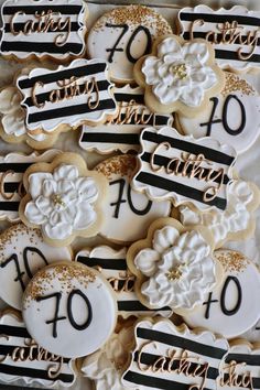 decorated cookies with black and white stripes are arranged in the shape of flowers