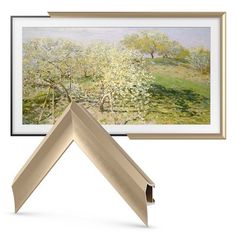 the frame is open to show an image of trees in bloom and grass below it