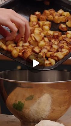 someone is cooking food in a pan on the stove and then placing it into a bowl